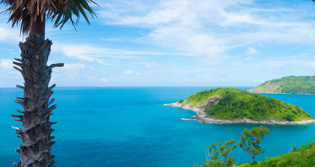 The panoramic landscape scenery of Phromthep Cape, a beautiful Andaman sea scenery of blue sea, blue sky with islands in Phuket, Thailand