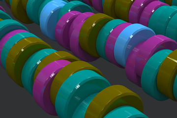 Pattern of blue, violet and green cylinder tablets on black background