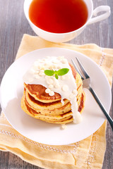 Stack of pancakes with white chocolate icing