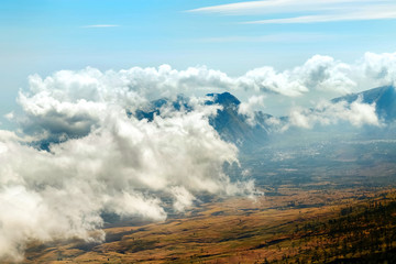 Mountain landscape in the clouds. View from above. Trekking on the  Rinjani mount. Indonesia.