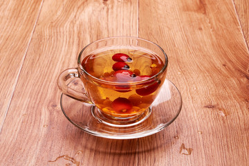 tea in a glass with berries