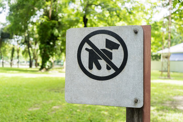 Do not dogs allowed sign, established in a green park