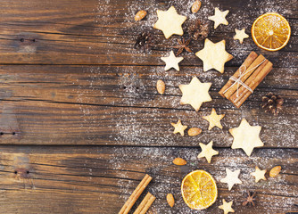 Christmas gingerbread cookies stars on a wooden table and coffe, selective focus