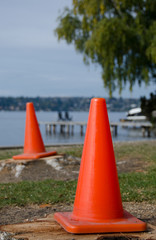 Fototapeta na wymiar Construction cones near Washington lake surf line in Medina beach park