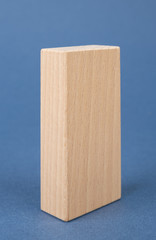 wooden geometric shapes on a blue