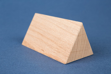 wooden geometric shapes on a blue