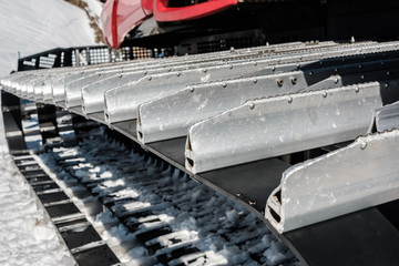 Snow grooming machine (Ratrak). Winter mountain landscape.
