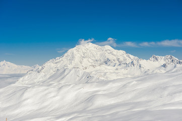 Alpine winter mountain landscape. French Alps with snow.