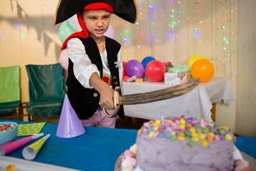 Boy pretending to be as pirate during birthday party