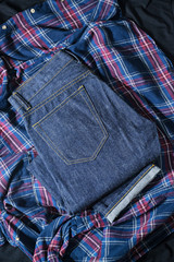 Blue Jeans Denim, 100% Cotton Unsanforized Denim Red Selvage Jeans on Plaid Shirt background, selective focus (detailed close-up shot)