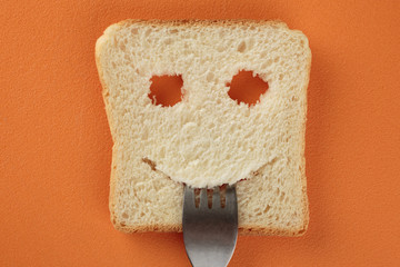 Happy toast with a fork in her mouth