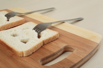 Happy toast with a fork in her mouth