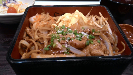 Japanese Bibimbap.Bibimbap Korean food in a black container