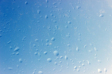Drops of rain on glass.  Abstract background.