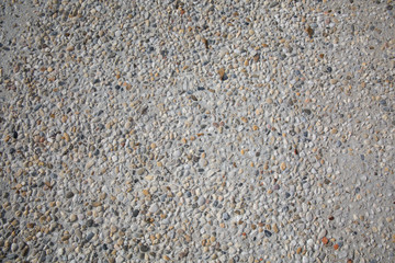 concrete floor with cement and pebble gravel