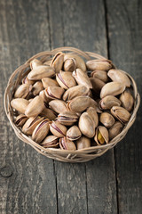 Healthy mix nuts on wooden background. Almonds, hazelnuts, cashews, peanuts, pistachios, brazilian nuts