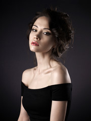 Naklejka premium Beautiful woman with elegant hairstyle on black background