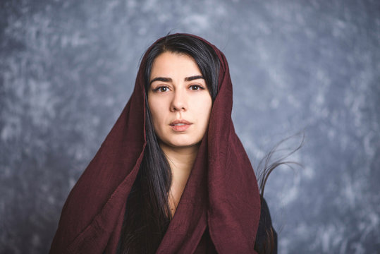 Portrait Of Arab Women With Long Hair In A Scarf