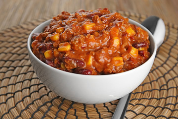 Chili con carne in bowl on table