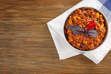 Chili con carne in bowl on table