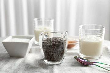 Ingredients for chia seed pudding on table