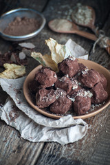 Coffee truffle on an old wooden table..