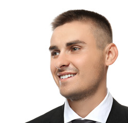 Handsome young businessman against white background