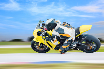 Fototapeta na wymiar Motorcycle leaning into a fast corner on highway