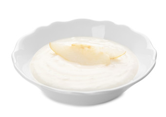 Plate with porridge for baby on white background