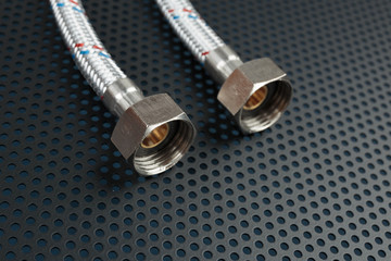 Water flexible hose in metallic braiding