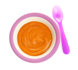 Bowl with baby food on white background