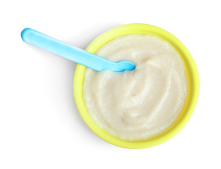 Bowl with baby food on white background