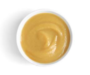 Bowl with baby food on white background