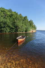 Fototapeta na wymiar old wooden boat on the river