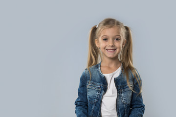 Beautiful Little Girl Happy Smiling Wear Jeans Coat Isolated Over Gray Background