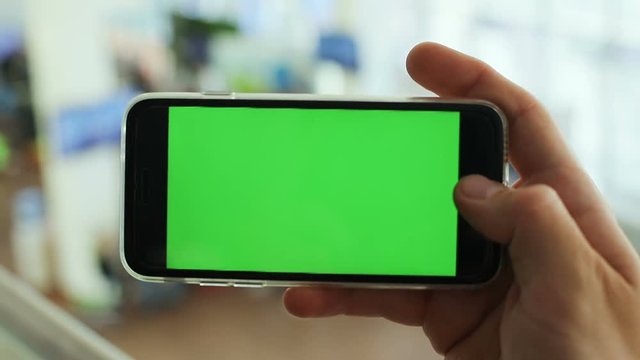 male person hand horizontal keeping holding green screen smartphone chroma key mockup telephone mobility concept connecting internet webpage digital gadget man businessman video call photography 3g