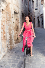 Fototapeta na wymiar Barefooted woman riding bicycle