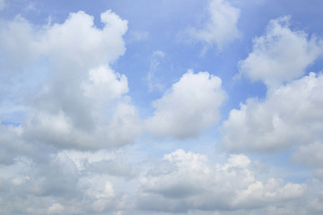 Bright blue sky with large fluffy clouds, summer cloudscape