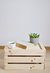Cup of Coffee, Book and Succulent on Wooden Box, Living or Bedroom with White Wall, Modern Design