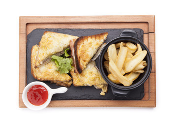 chicken club sandwich on a wooden cutting board isolated on white