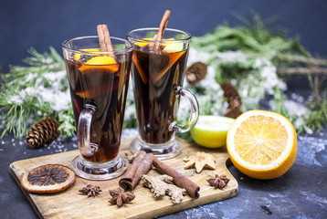 Two glasses of fragrant mulled wine on the Christmas background. Traditional Christmas drink.
