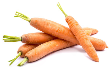 Group of five whole orange carrots isolated on white background