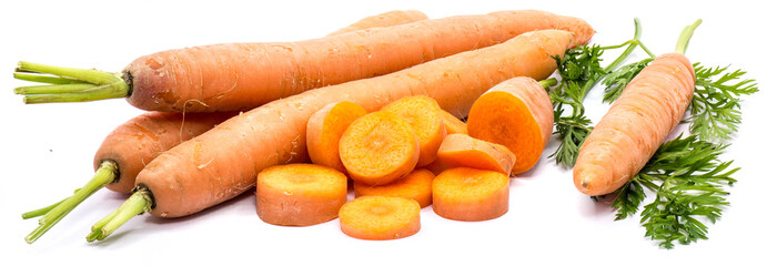 Group of whole orange carrots with fresh green leaf and round circles isolated on white background