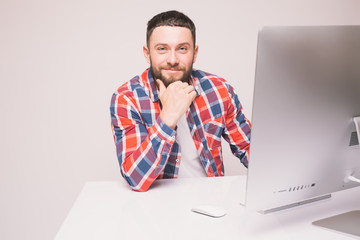Handsome Man working on computer with isolated screen in office interior.