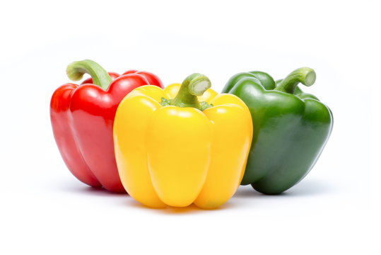 group of three colors sweet bell pepper on white background ( Capsicum annuum., SOLANACEAE )