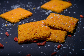 vegan cereal crackers on a black background