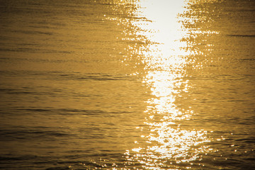 Background or texture of sea water at sunrise