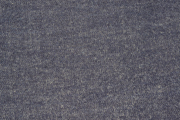 Fototapeta na wymiar Texture of Blue Jeans, 100% Cotton Unsanforized Denim Red Selvage Jeans vintage tone color style background, selective focus (detailed close-up shot)
