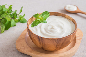 Yogurt in wooden bowl