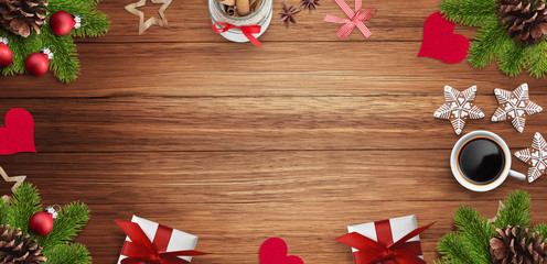 Christmas decoration, gift, cup of coffee and gingerbread cookies on wooden table. Empty space for text input